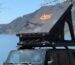 Jeep with FoxTent rooftop tent parked beside a mountain lake in British Columbia